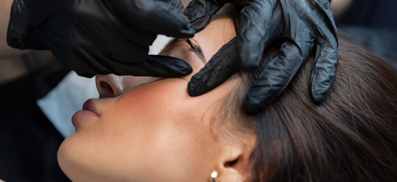 young-woman-getting-beauty-treatment-her-eyebrows